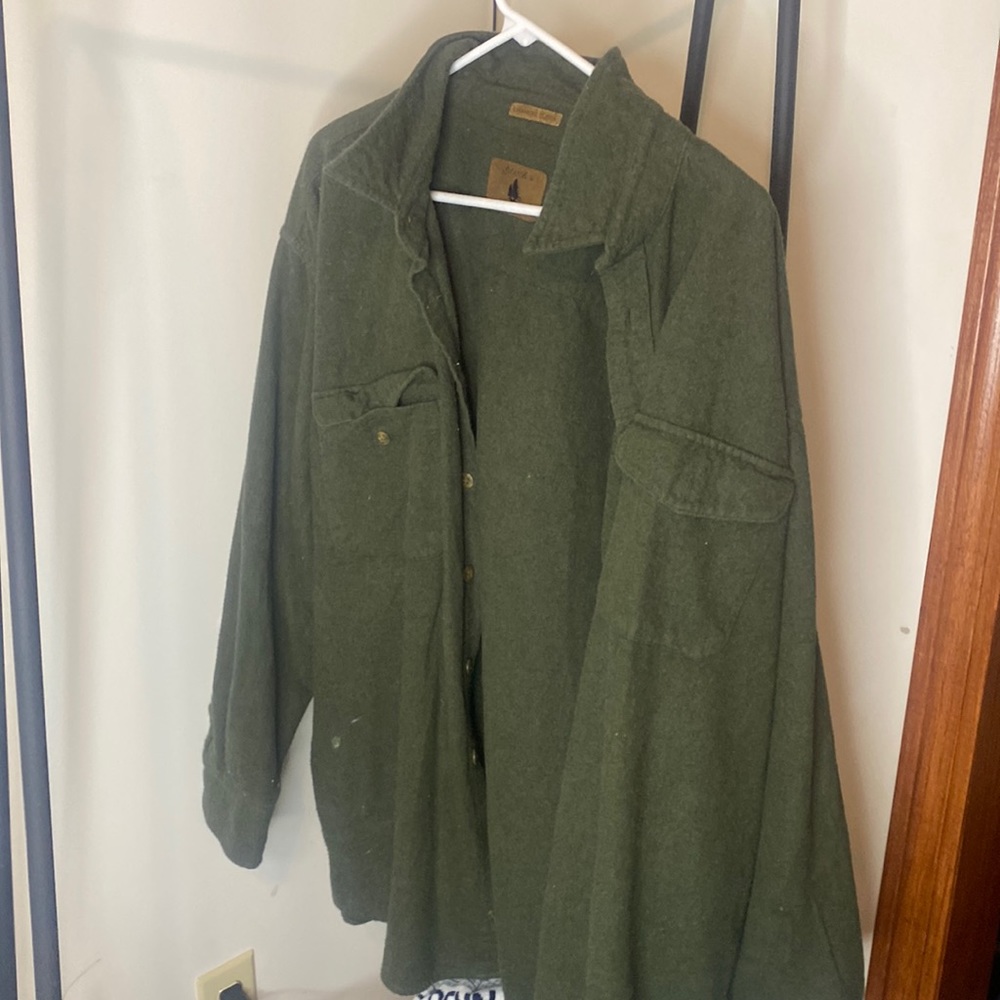 A hunter green button up jacket super warm.